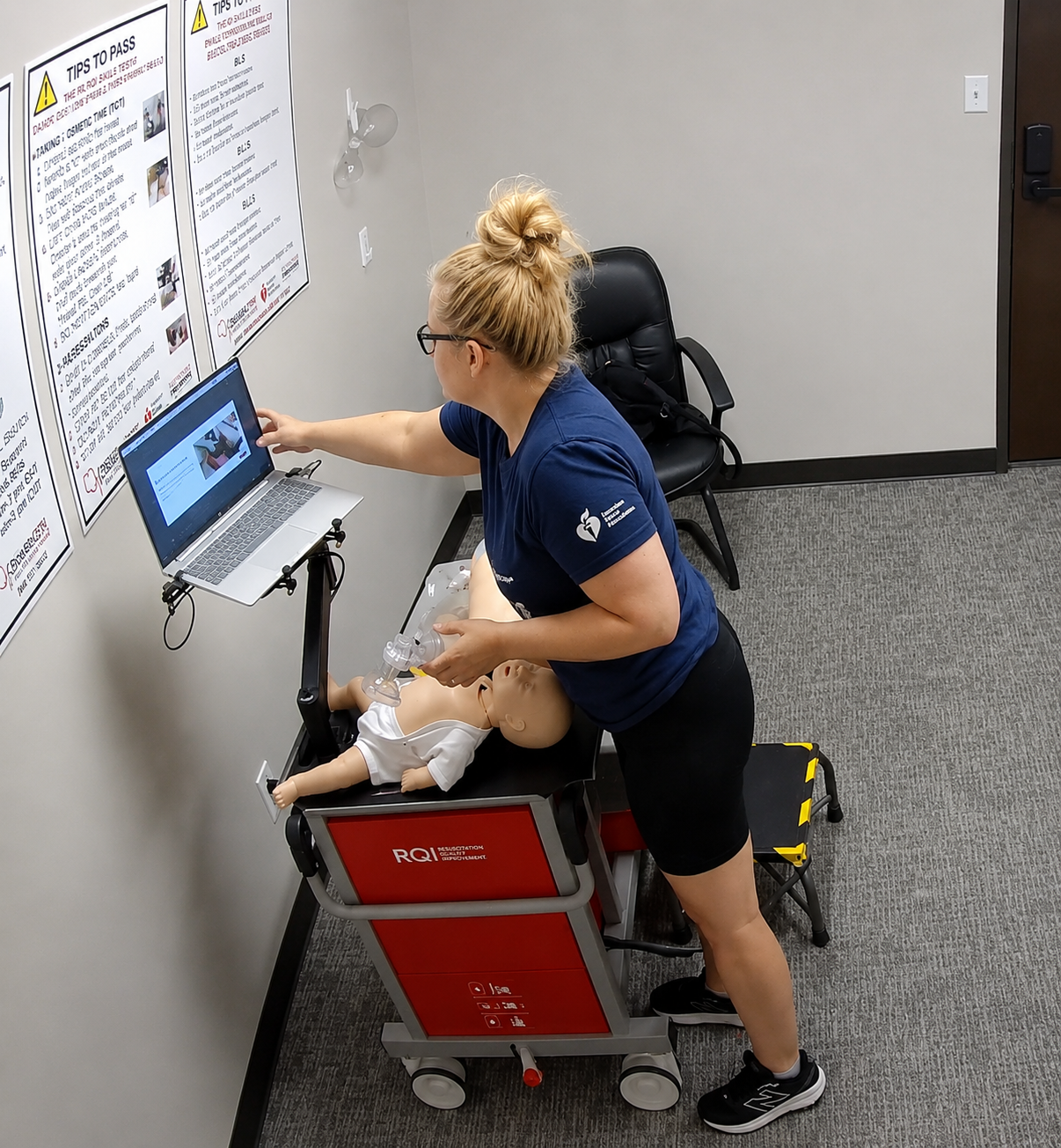 Healthcare professional practicing infant CPR during an American Heart Association BLS, ACLS, or PALS skills session at Citywide CPR.