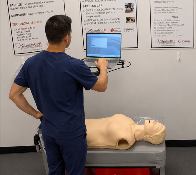 Healthcare professional preparing for an ACLS skills session at a Citywide CPR Verification Station.