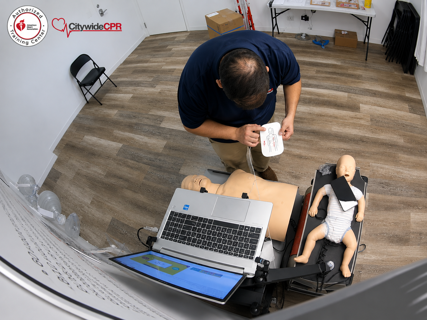 Portable American Heart Association Heartsaver Direct CPR manikin and training station for employee First Aid CPR AED training.