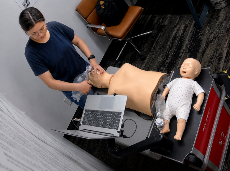 Healthcare professional completing hands-on ACLS skills on a training manikin at a Citywide CPR location in New York City.