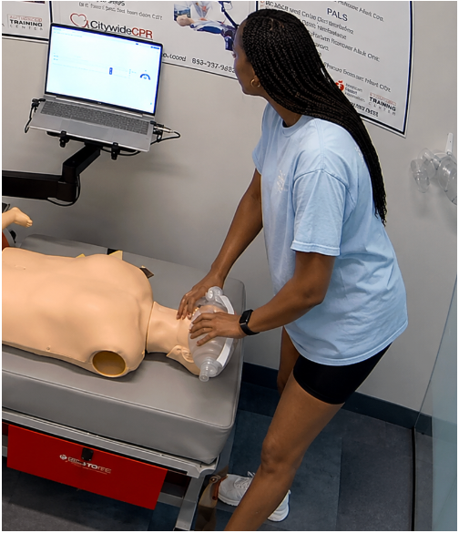 Healthcare professional performing BLS skills on an adult manikin during a Skills Only session at a CPR Verification Station.