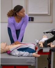 Healthcare staff participating in CPR and resuscitation skills training.