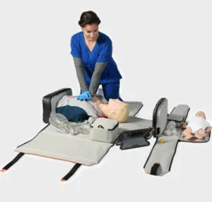 Healthcare professional performing CPR skills using an RQI-P GO portable training system for onsite CPR and BLS training