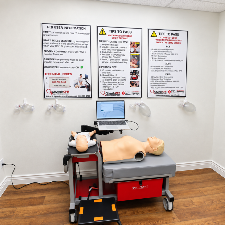 Citywide CPR Self-Guided Skills Station in Waco, Texas with adult and infant CPR manikins, laptop, and training instructions.